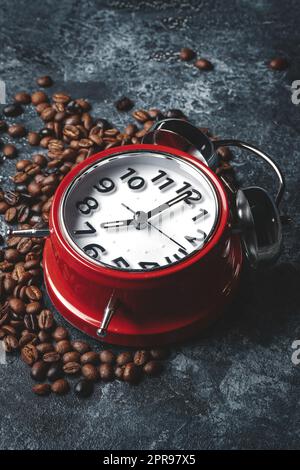 front view of coffee seeds with clocks on dark surface textured cocoa grain group Stock Photo
