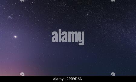 Night Starry Sky With Glowing Stars. Bright Glow Of Planet Venus In Sky Among The Stars. Starry Backdrop Background Stock Photo