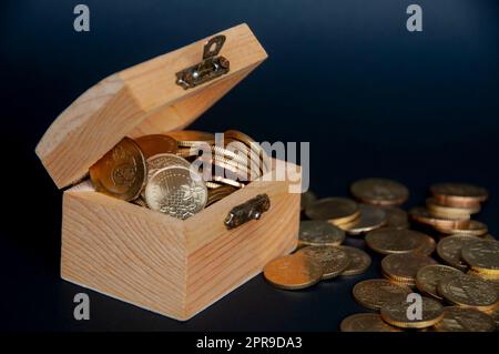 Treasure chest with gold coins on white background Stock Photo - Alamy