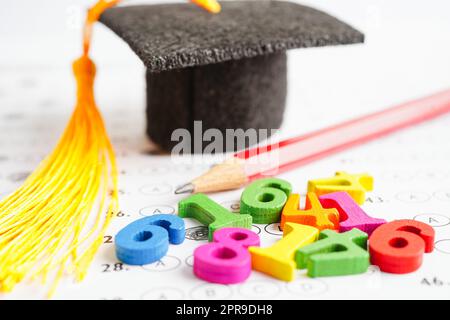 Math number with graduation gap hat on answer sheet test choice for learning Mathematic, education math concept. Stock Photo