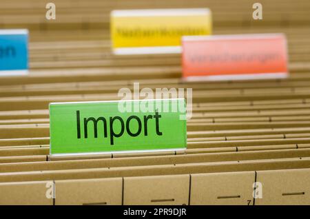 Hanging file folder labeled with Import Stock Photo