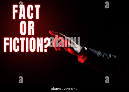 Inspiration showing sign Fact Or Fiction. Business showcase Is it true or is false doubt if something is real authentic Businessman Pointing Important Infortmations With One Finger. Stock Photo