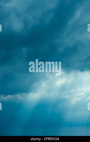 Sunrays Through Blue Rainy Dramatic Sky. Natural Abstract Background Stock Photo