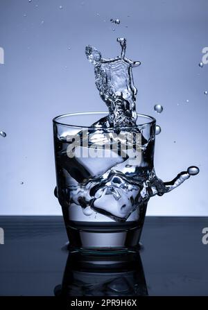 The image of pouring drinking water, into a glass Stock Photo