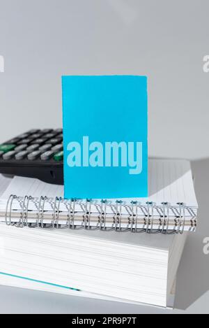 Important Message Presented On Piece Of Paper On Desk With Calculator, Books And Notebook. Crutial Information Written On Note. New Ideas Displayed On Memo. Stock Photo
