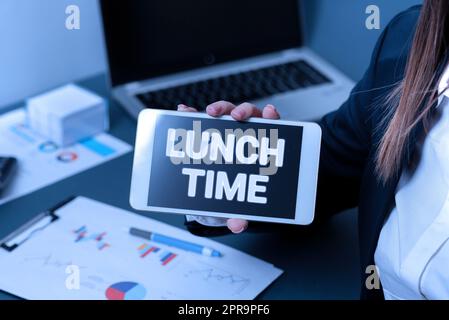 Writing displaying text Lunch Time. Word Written on Meal in the middle of the day after breakfast and before dinner Businesswoman Holding Phone With Important Message With One Hand. Stock Photo