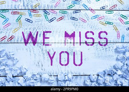 Writing displaying text We Miss You. Business overview Feeling sad because you are not here anymore loving message Paper Wraps And Paperclips Placed Around Important Informations. Stock Photo