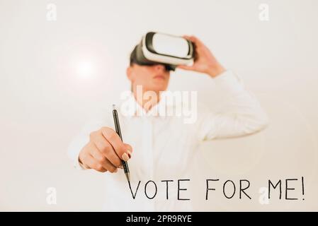 Hand writing sign Vote For Me. Business showcase Campaining for a government position in the upcoming election Woman Wearing Vr Glasses And Pointing On Recent Updates With Pen. Stock Photo