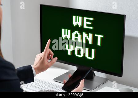 Text sign showing We Want You. Business concept Company wants to hire Vacancy Looking for talents Job employment Businesswoman Holding Mobile Phone And Pointing On Computer Screen. Stock Photo
