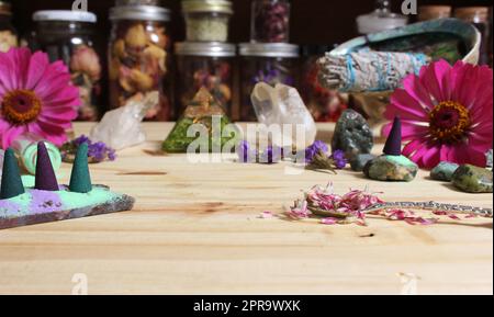 Incense Cones on Stone Slab With Crystals and Flowers Stock Photo