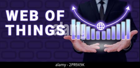 Sign displaying Web Of Things. Business concept Internet technology online modern data service communication Businessman Holding Growth Graph Over Hands And Showing New Data. Stock Photo