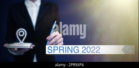 Text sign showing Spring 2022. Business overview time of year where flowers rise following winter season Lady in suit holding pen symbolizing successful teamwork accomplishments. Stock Photo