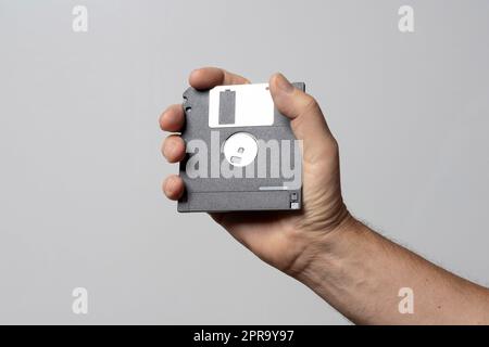 Floppy disk on hand Stock Photo