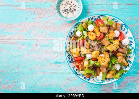 Healthy Grilled Chicken Caesar Salad with Cheese and Croutons Stock Photo