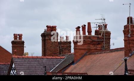 Clay chimney pots on rooftops Stock Photo