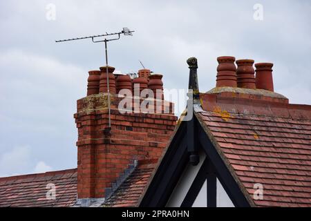 Clay chimney pots on rooftops Stock Photo
