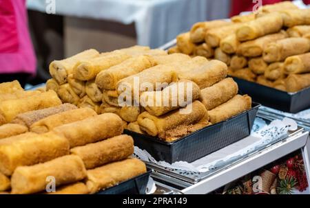 A heap of traditional Polish meat croquettes on a traditional festive market stall, detail shot, buying and selling natural organic food products. Foo Stock Photo