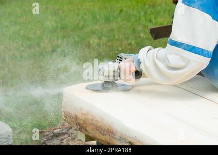 Sanding wood with an angle grinder Stock Photo