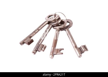 A simple set of 4 old worn metal keys on one keychain, object isolated on white, cut out, nobody. Prison jail cell keys key chain, safety, security me Stock Photo