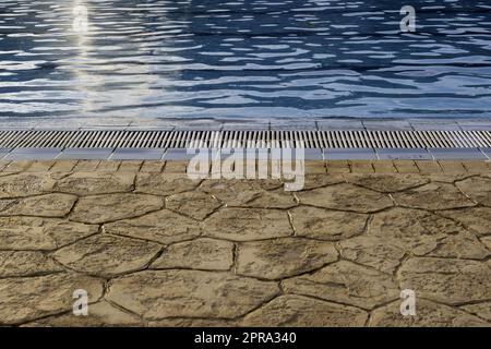Edge of a swimming pool Stock Photo