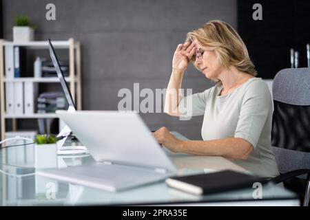Unhappy Sad Business Woman. Stress And Headache Stock Photo