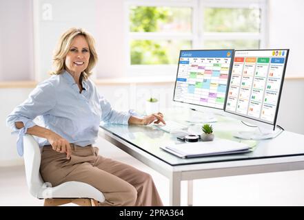Digital Calendar Schedule Software In Office Stock Photo