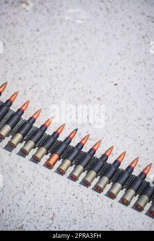 Machine gun belt loaded with cartridges Stock Photo