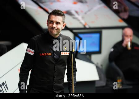 Mark Selby celebrates after defeating John Higgins (right) on day twelve of the Cazoo World Snooker Championship at the Crucible Theatre, Sheffield. Picture date: Wednesday April 26, 2023. Stock Photo