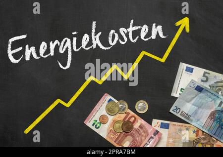 Text on blackboard with Euros - Energy costs  in german - Energiekosten Stock Photo