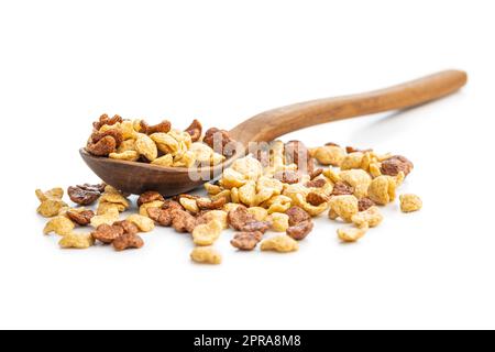 Breakfast cereal flakes in wooden spoon isolated on white background. Stock Photo
