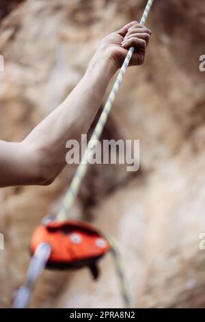 Hand holding a rock climbing rope Stock Photo