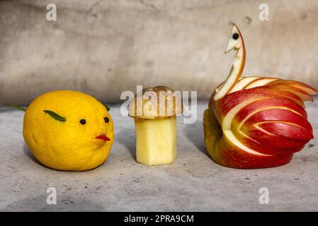 Animal-shaped decorations made of fruits and vegetables Stock Photo