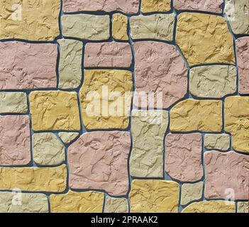 Wall made of colored stones as background Stock Photo