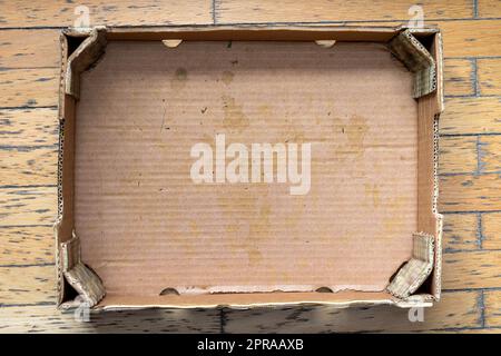 Empty cardboard box on floor Stock Photo