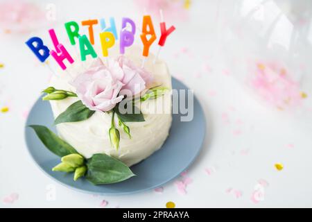 Classical birthday cake design with a lot of flowers of cream Stock Photo -  Alamy