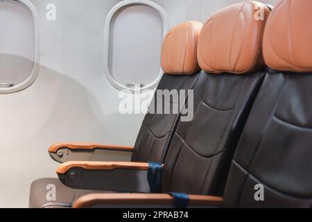 Empty aircraft seats and windows, passenger seat interior airplane Stock Photo