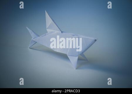 Paper shark origami isolated on blank background Stock Photo