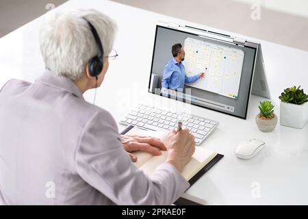 Woman Participating In Online Coaching Session Stock Photo