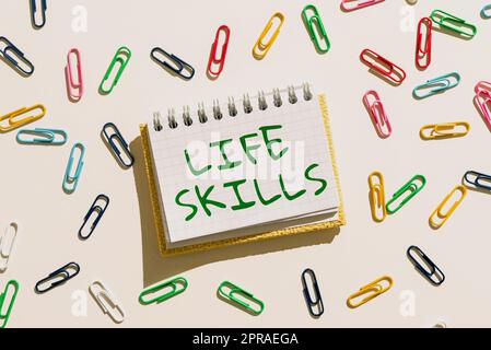 Hand writing sign Life Skills. Conceptual photo that is necessary or desirable full participation in everyday Important Message Written On Notebook With Colorful Paperclips Around. Stock Photo