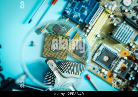 Chipset on blur electronic circuit board of PC motherboard. CPU chip. Electronic components of computer. Hi-tech industry. Microelectronics hardware. Computer processor. Computer upgrade and repair. Stock Photo