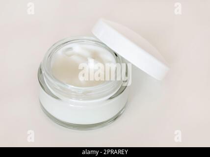 Opened Cosmetic jar with a lid on white close up, mockup. Everyday skincare routine Stock Photo