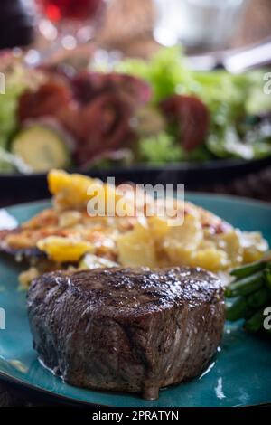 steak with potato gratin Stock Photo