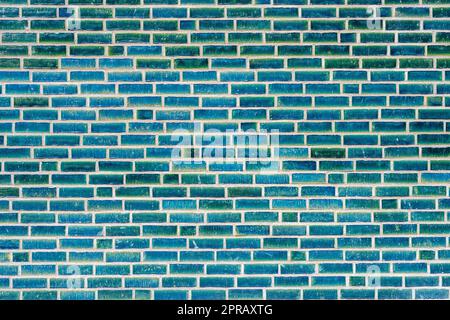 Background from a wall made of turquoise clinker bricks Stock Photo