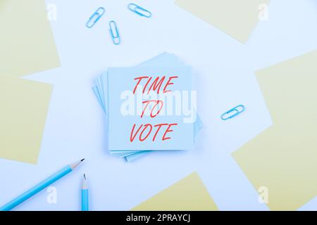 Sign displaying Time To Vote. Business concept Election ahead choose between some candidates to govern Important Message Presented On Notes With Paperclips And Colored Pen Around Stock Photo