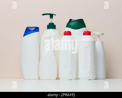Various white plastic bottles for cosmetics, liquid soap, gel and shampoo Stock Photo