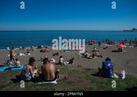 Malaga, Spain. 26th Apr, 2023. Bathers are seen sunbathing at 'La Malagueta' beach as they enjoy the good weather amid an unusual heat wave. Spain is experiencing an unusual episode of high temperatures in April, months before the beginning of summer. According to the Spanish State Meteorological Agency, temperatures of over 35 degrees will be reached in most of the country. (Photo by Jesus Merida/SOPA Images/Sipa USA) Credit: Sipa USA/Alamy Live News Stock Photo