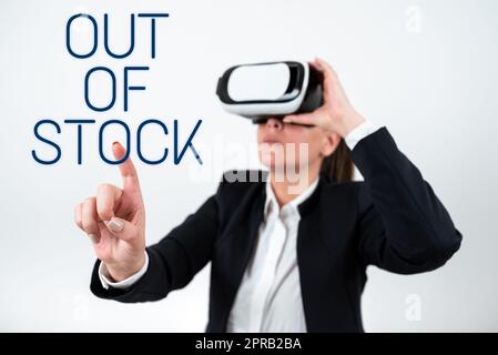 Text caption presenting Out Of Stock. Internet Concept Not available anymore outside the standard rate of market Woman Wearing Vr Glasses And Pointing On Important Message With One Finger. Stock Photo