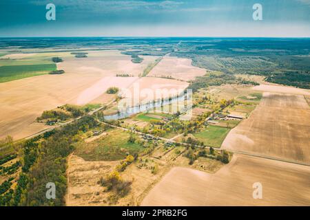 Vasilyovka, Dobrush District, Gomel Region, Belarus. Aerial View Of Small Village With Wooden Houses At Spring Day. Beautiful Rural Landscape In Bird's-eye View Stock Photo