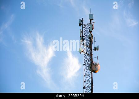 5G technology wireless communication tower smartphone broadcasting internet connection Stock Photo