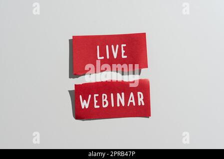 Text showing inspiration Live Webinar. Business showcase Interactive seminar transmitted over the web Real Time Ripped Sticky Note With Important Messages Presented On Desk. Stock Photo